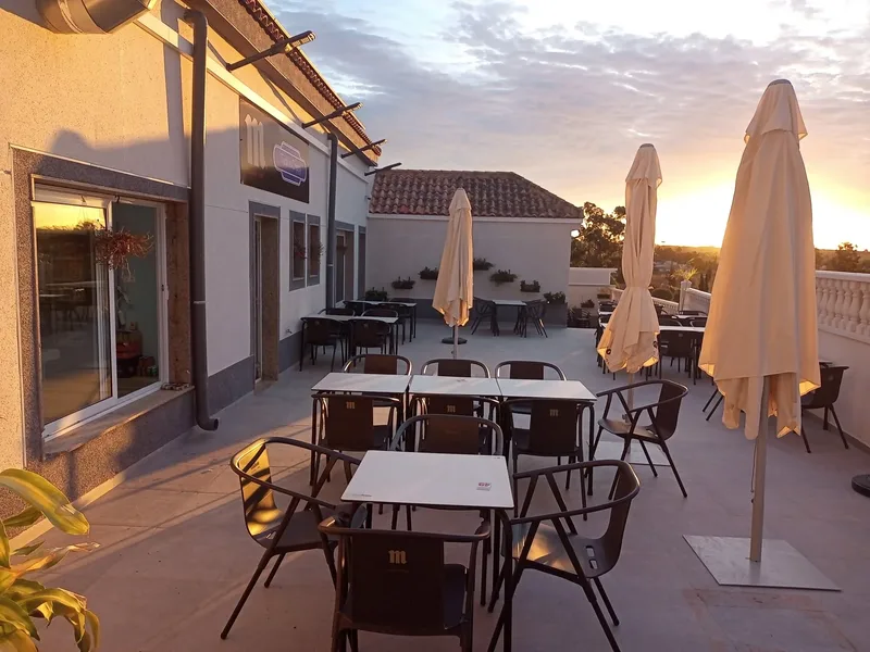 The outside terrace at Tuck In Chippy at sunset